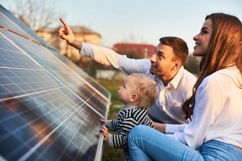 solar panel buying guide family looking at a solar panel deciding where to buy solar panels